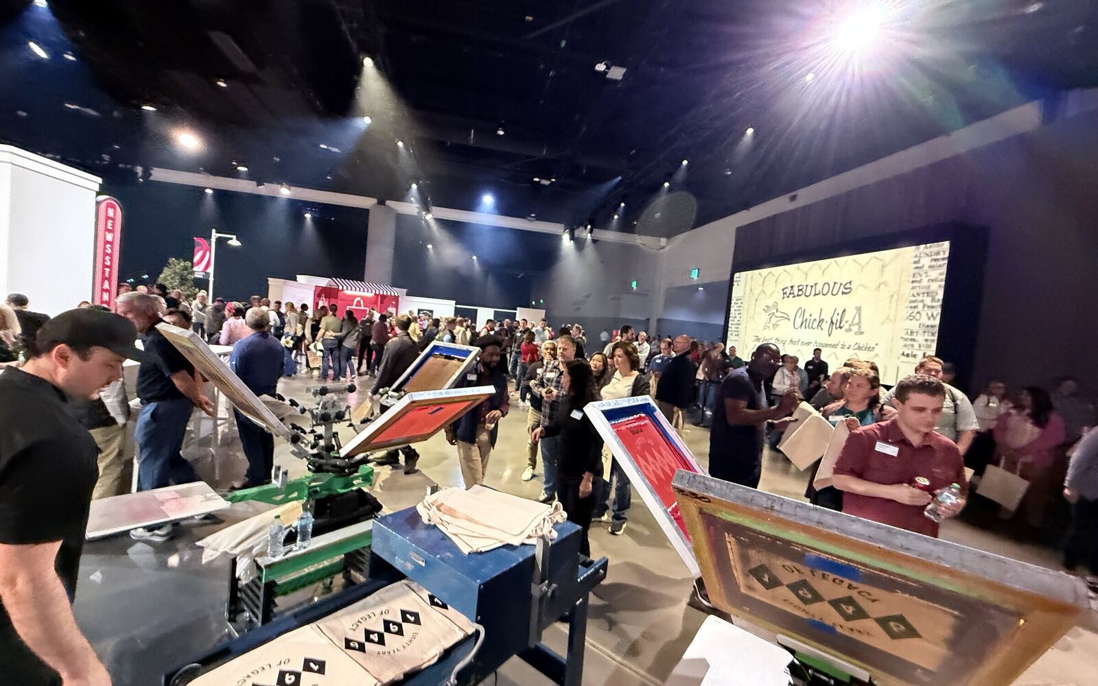 Corporate t-shirt printing station at an indoor event